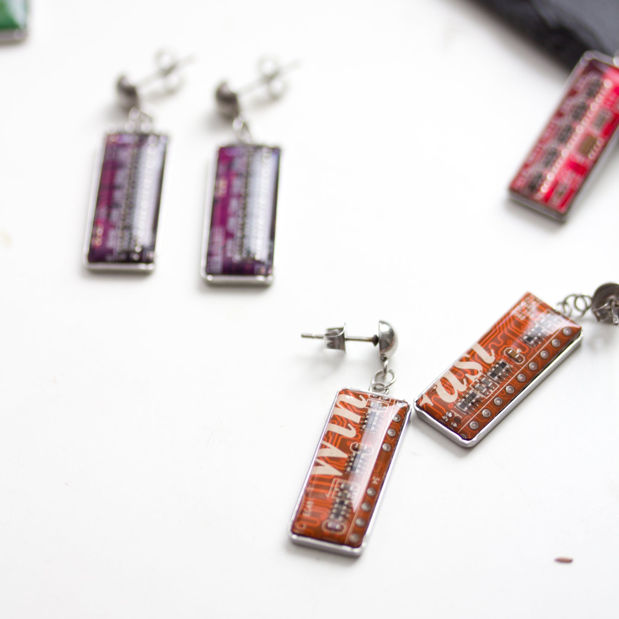 Stud / dangle earrings with rectangular circuit board pendants, steel wires