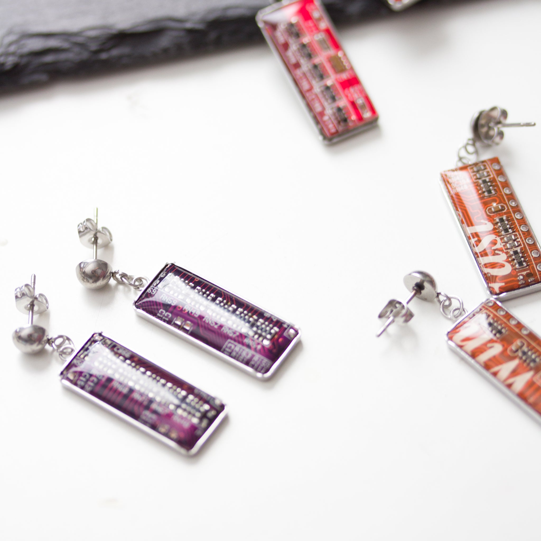 Stud / dangle earrings with rectangular circuit board pendants, steel wires
