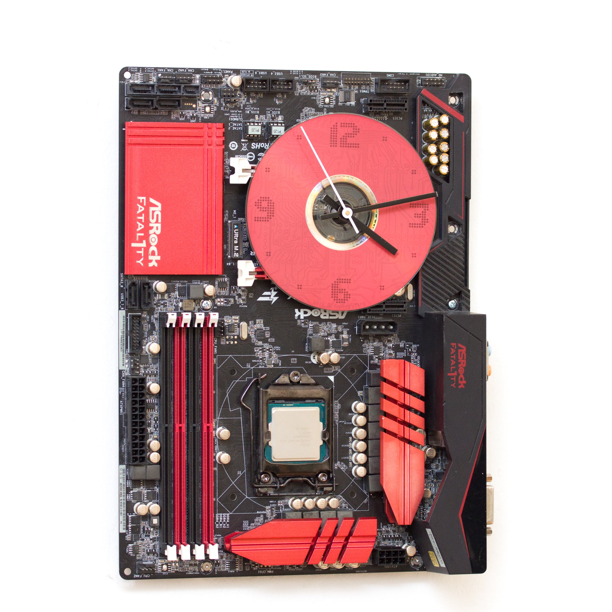 Wall Clock made of a black / dark brown circuit board with a red clock face