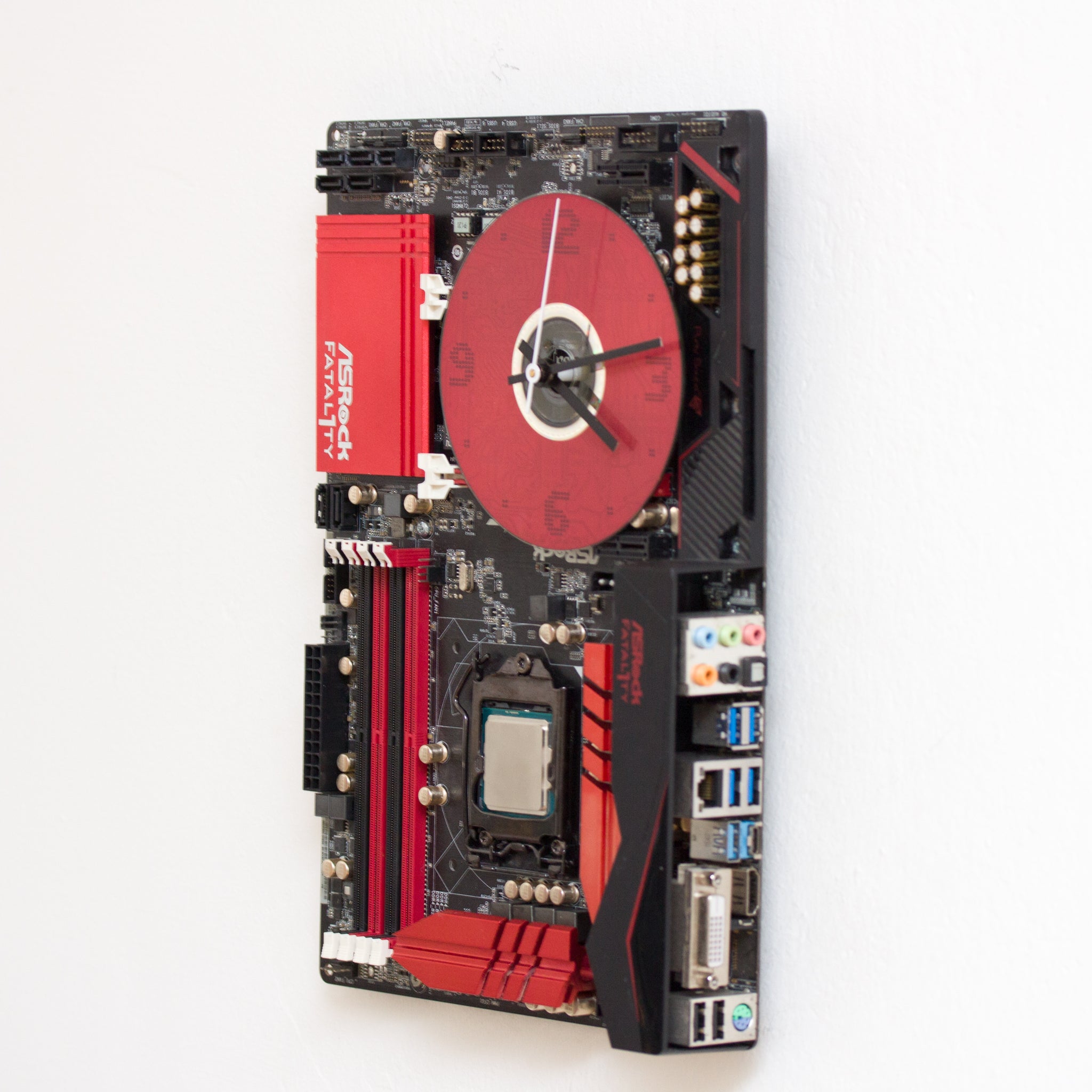 Wall Clock made of a black / dark brown circuit board with a red clock face