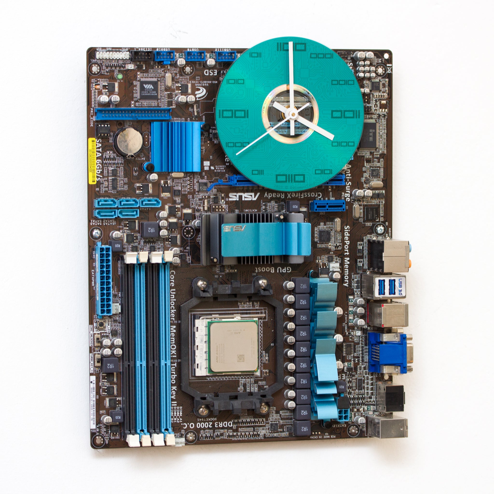 Geeky Wall Clock made of a black / dark brown circuit board with a blue clock face