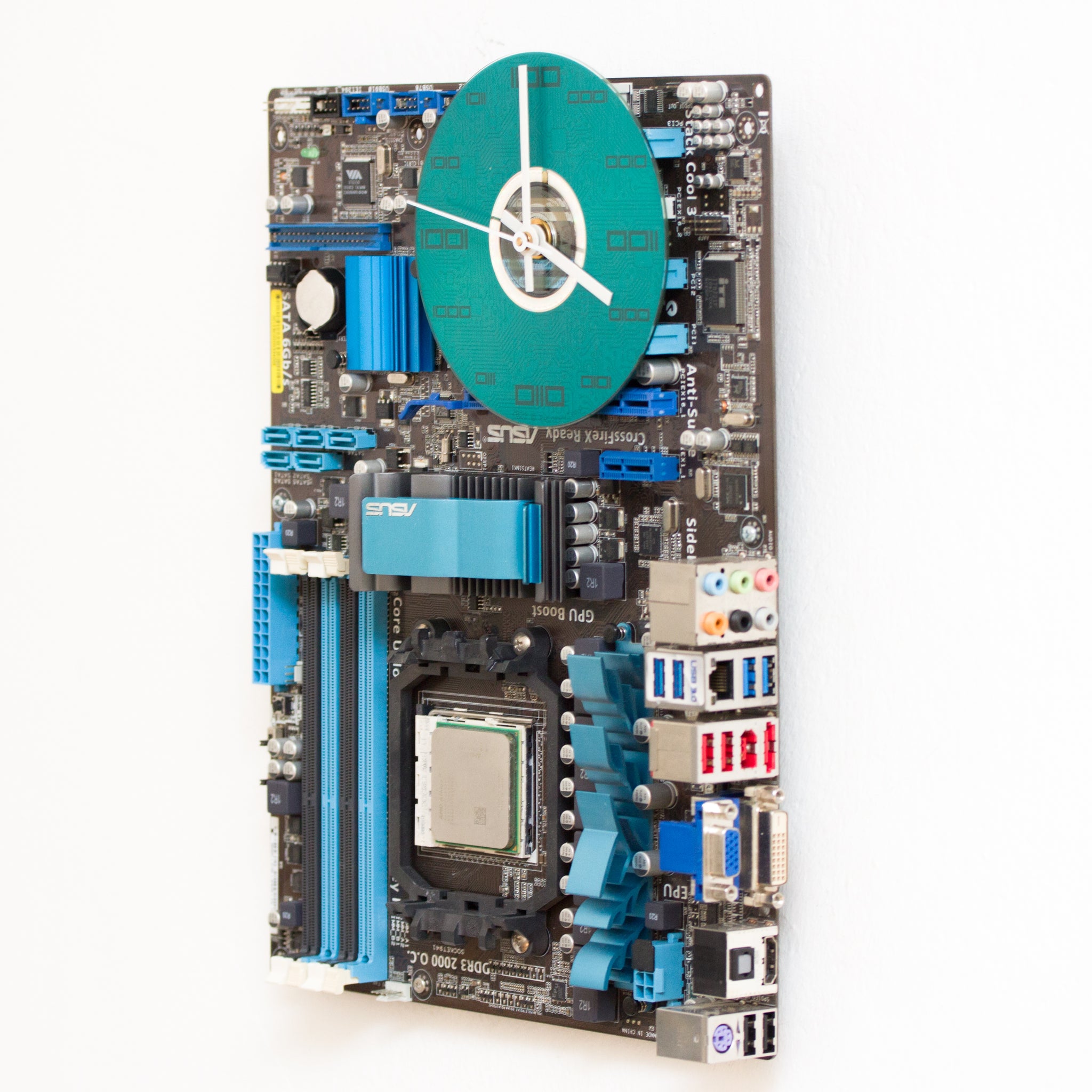 Geeky Wall Clock made of a black / dark brown circuit board with a blue clock face