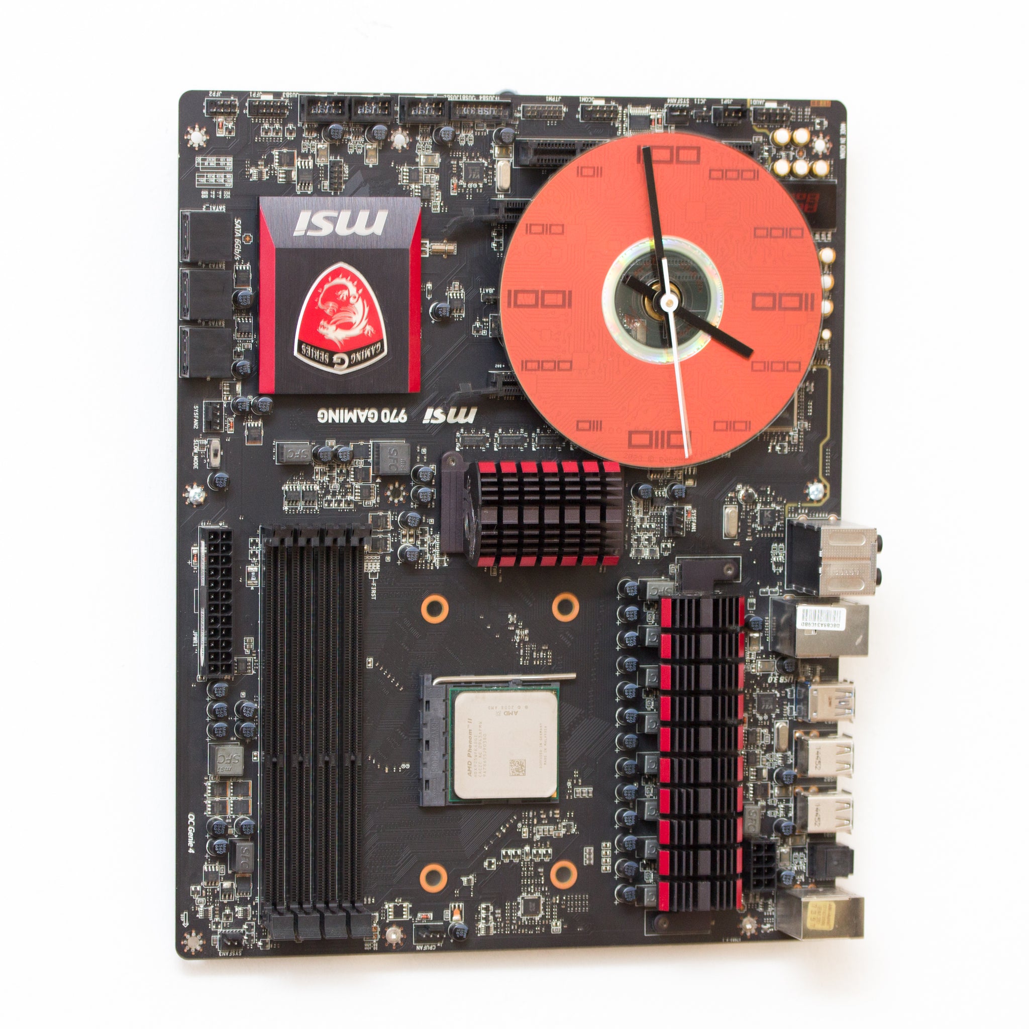 Wall Clock made of a black / dark brown circuit board with a red clock face