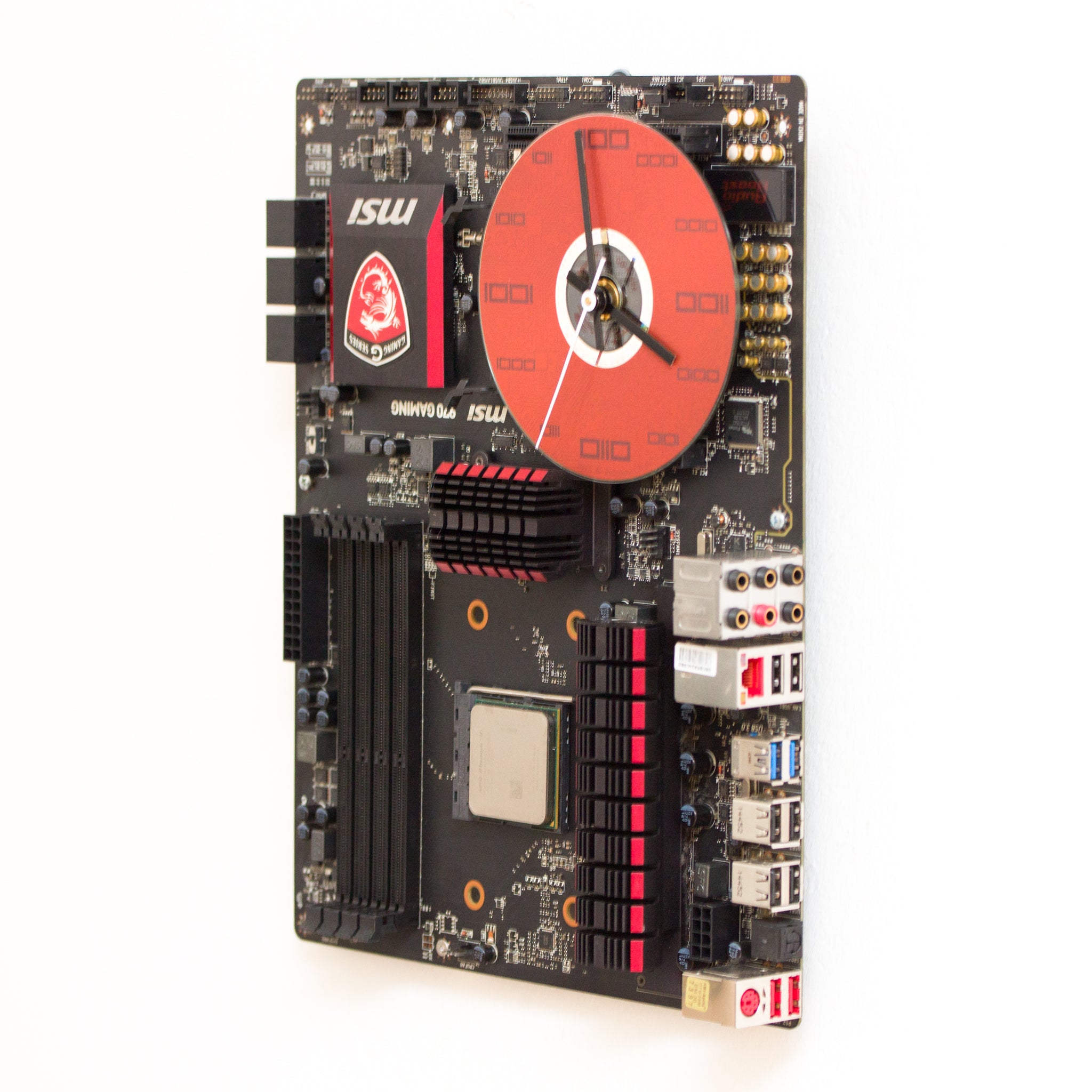 Wall Clock made of a black / dark brown circuit board with a red clock face