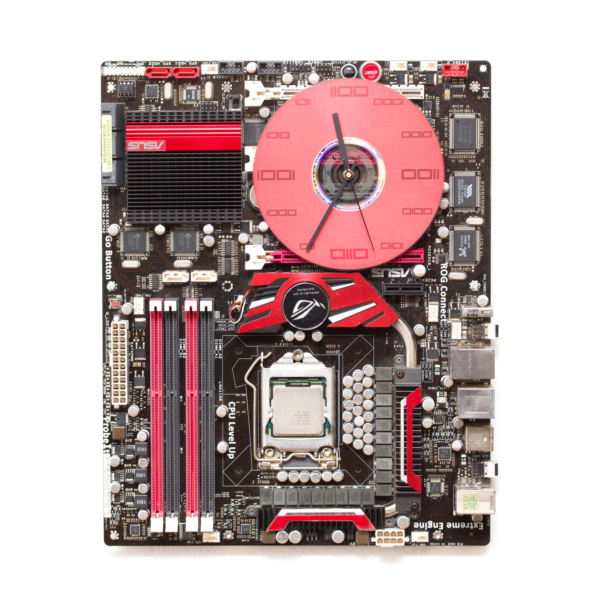 Geeky Wall Clock made of a black / dark brown circuit board with a red clock face