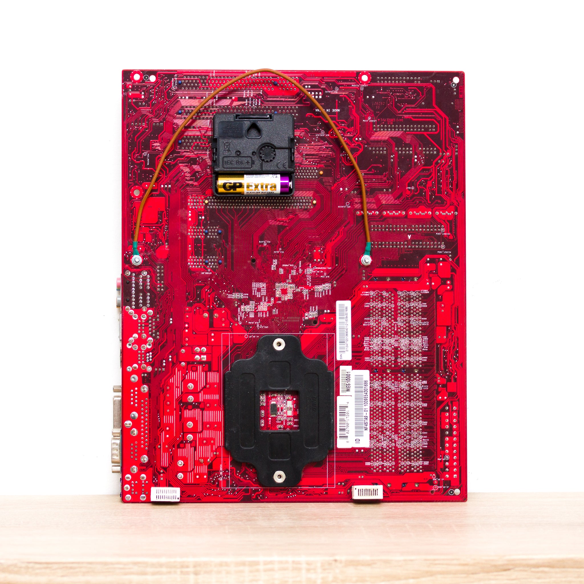Wall Clock made of red computer motherboard