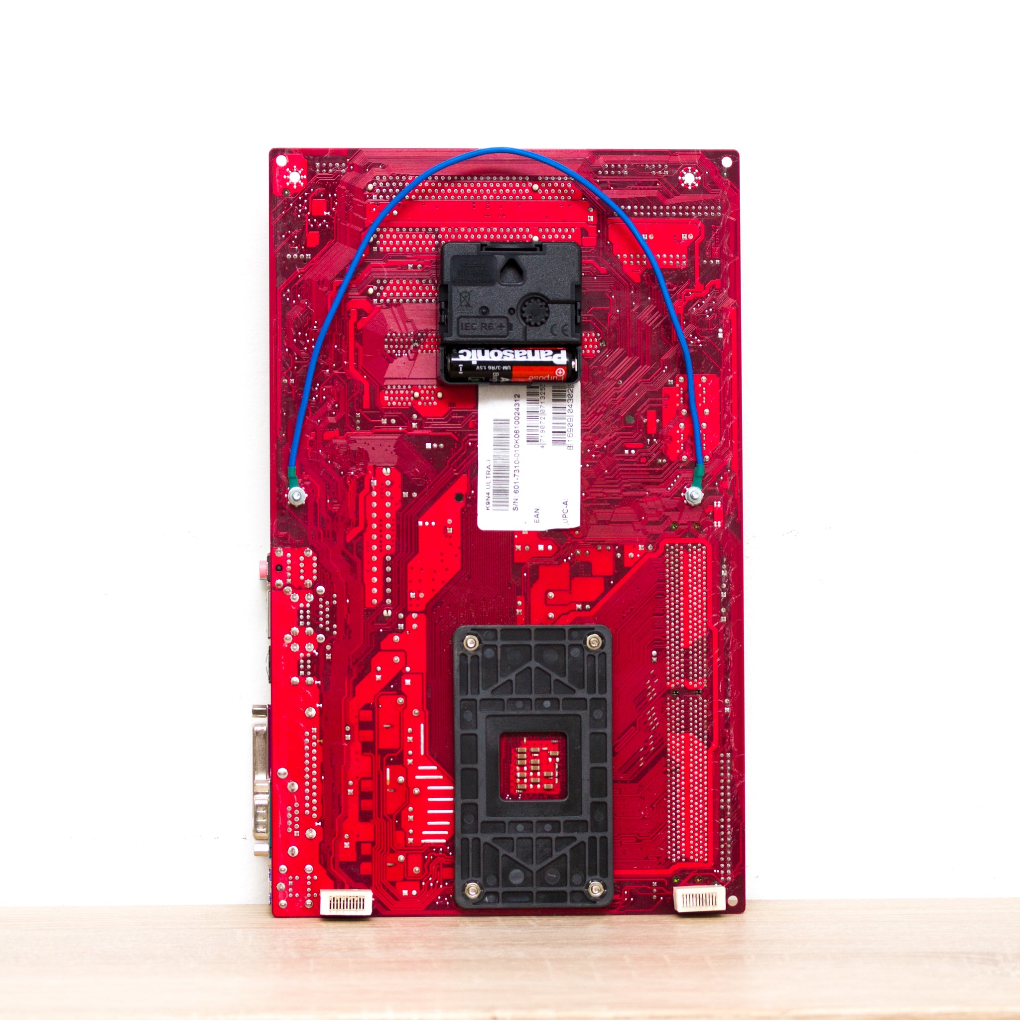Wall Clock made of red computer motherboard