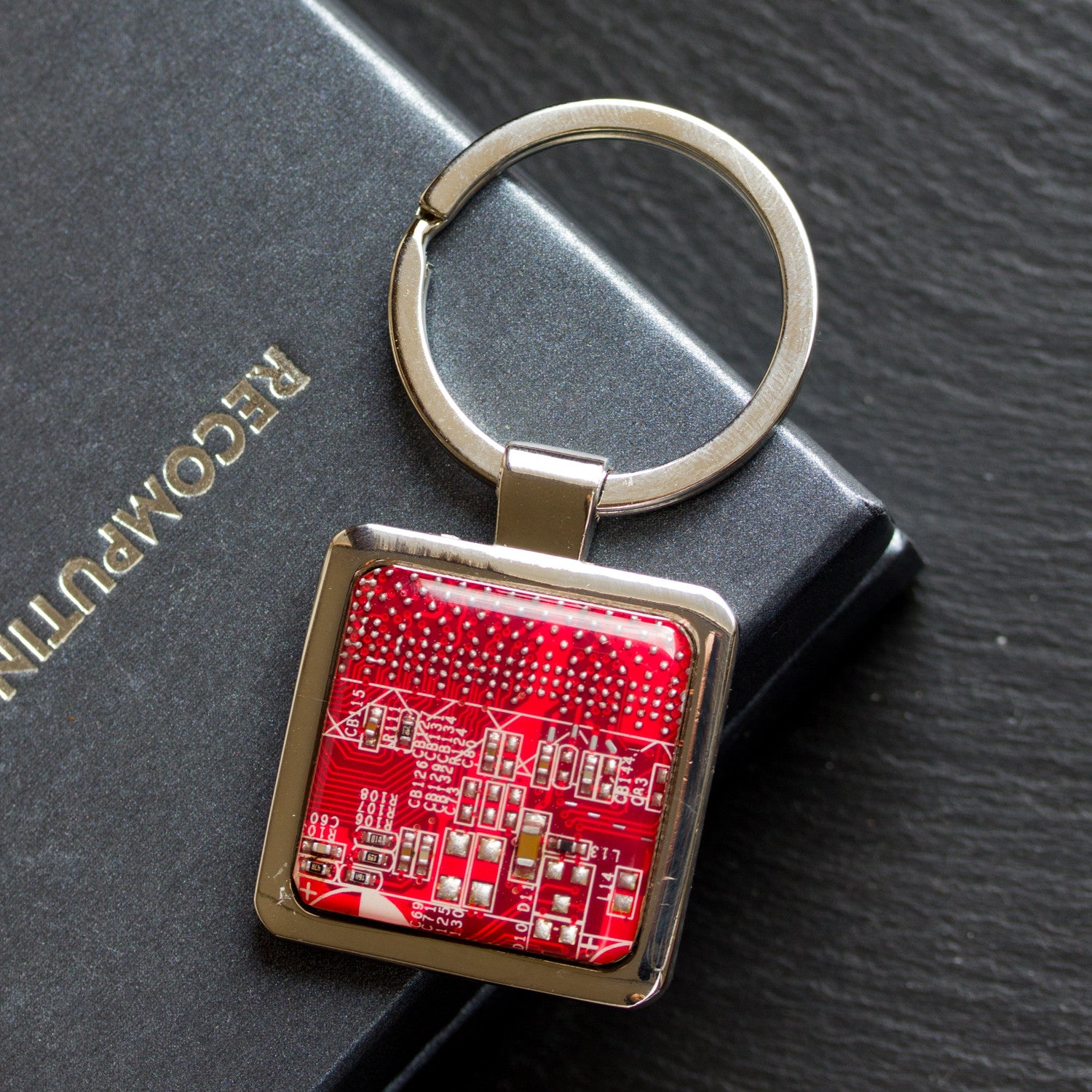 Unique keychain with circuit board piece