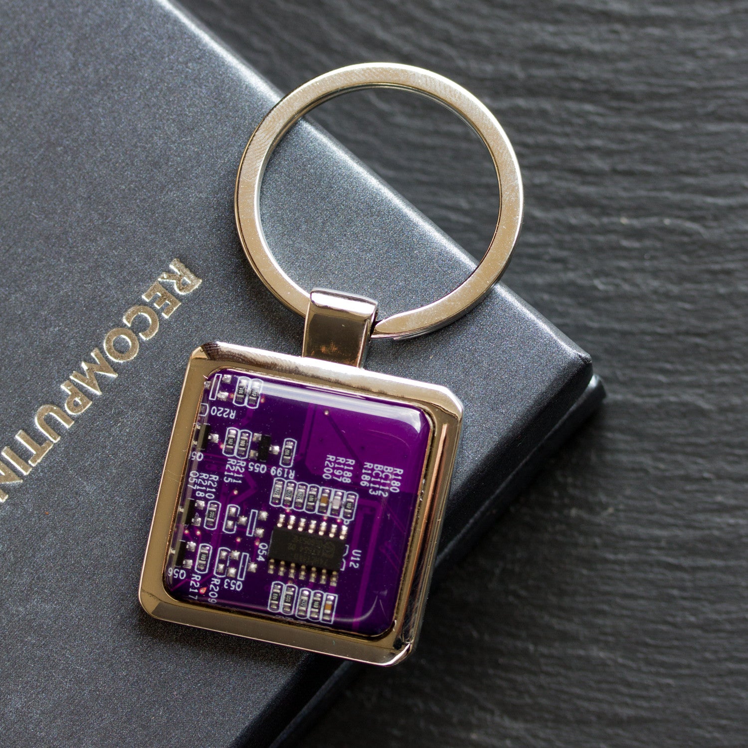 Unique keychain with circuit board piece