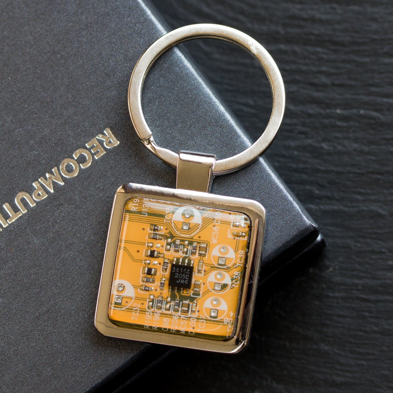 Unique keychain with circuit board piece