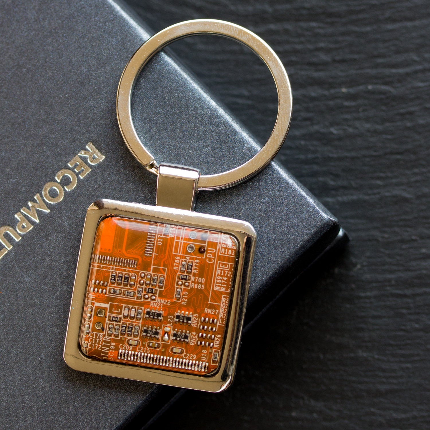 Unique keychain with circuit board piece