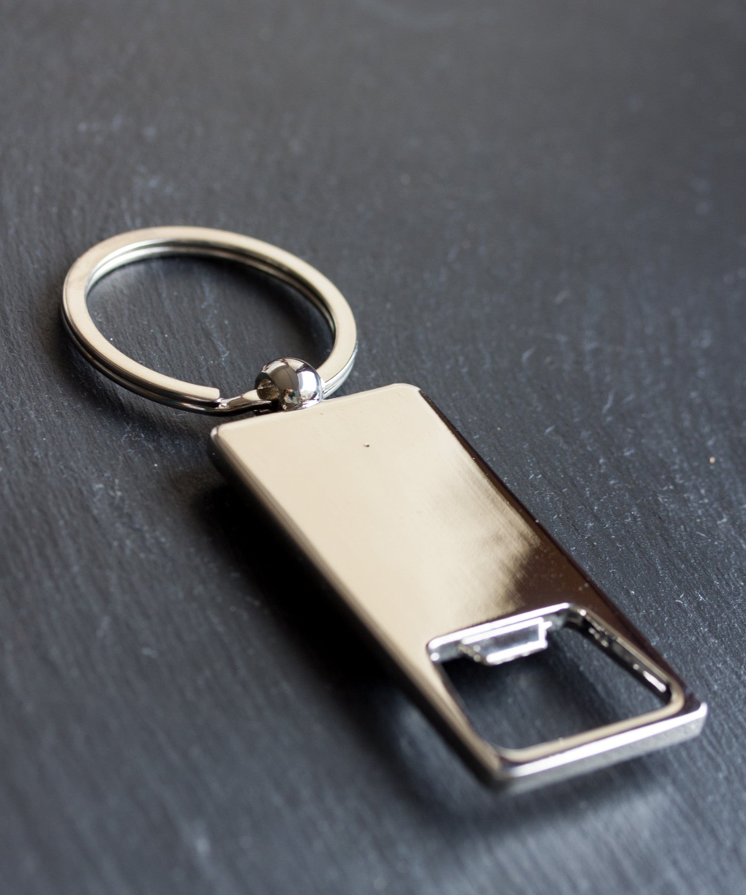 Bottle opener keychain with a circuit board piece