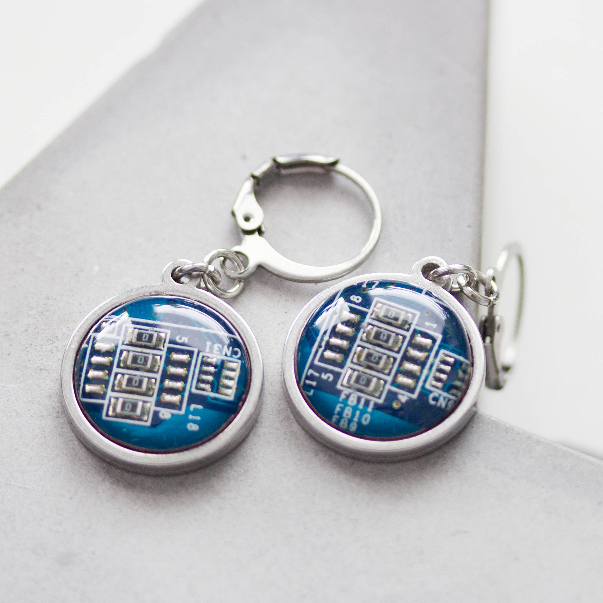 Dangle earrings with 15mm round circuit board pendants, steel wires