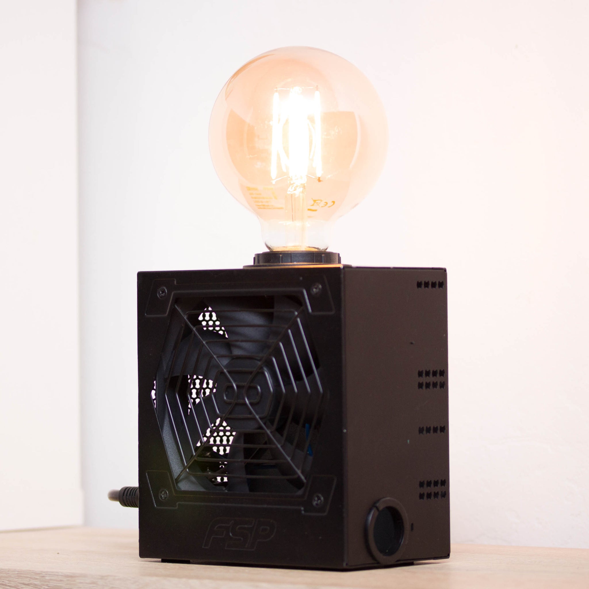 Table lamp made with recycled computer power supply unit