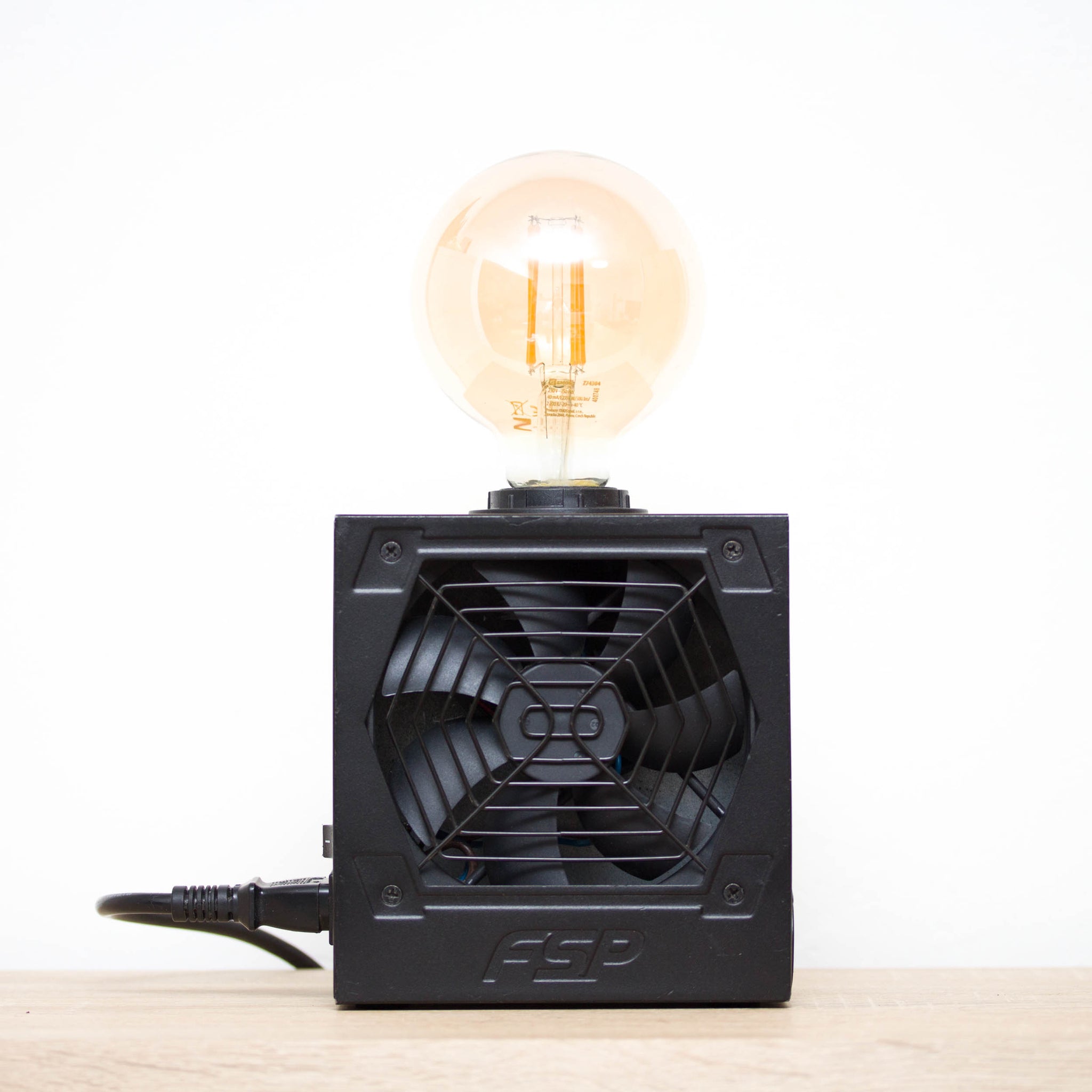 Table lamp made with recycled computer power supply unit