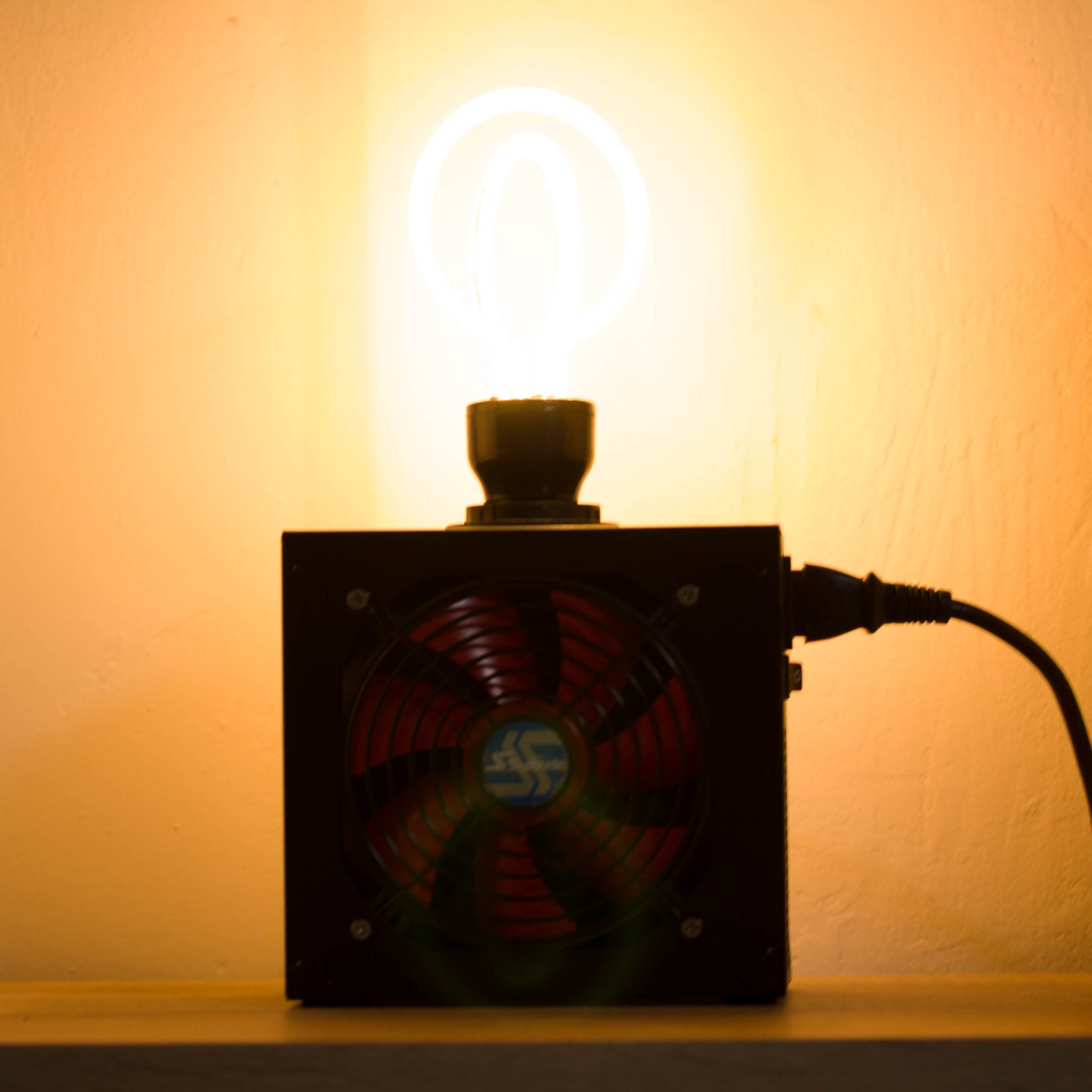 Table lamp made with recycled computer power supply unit