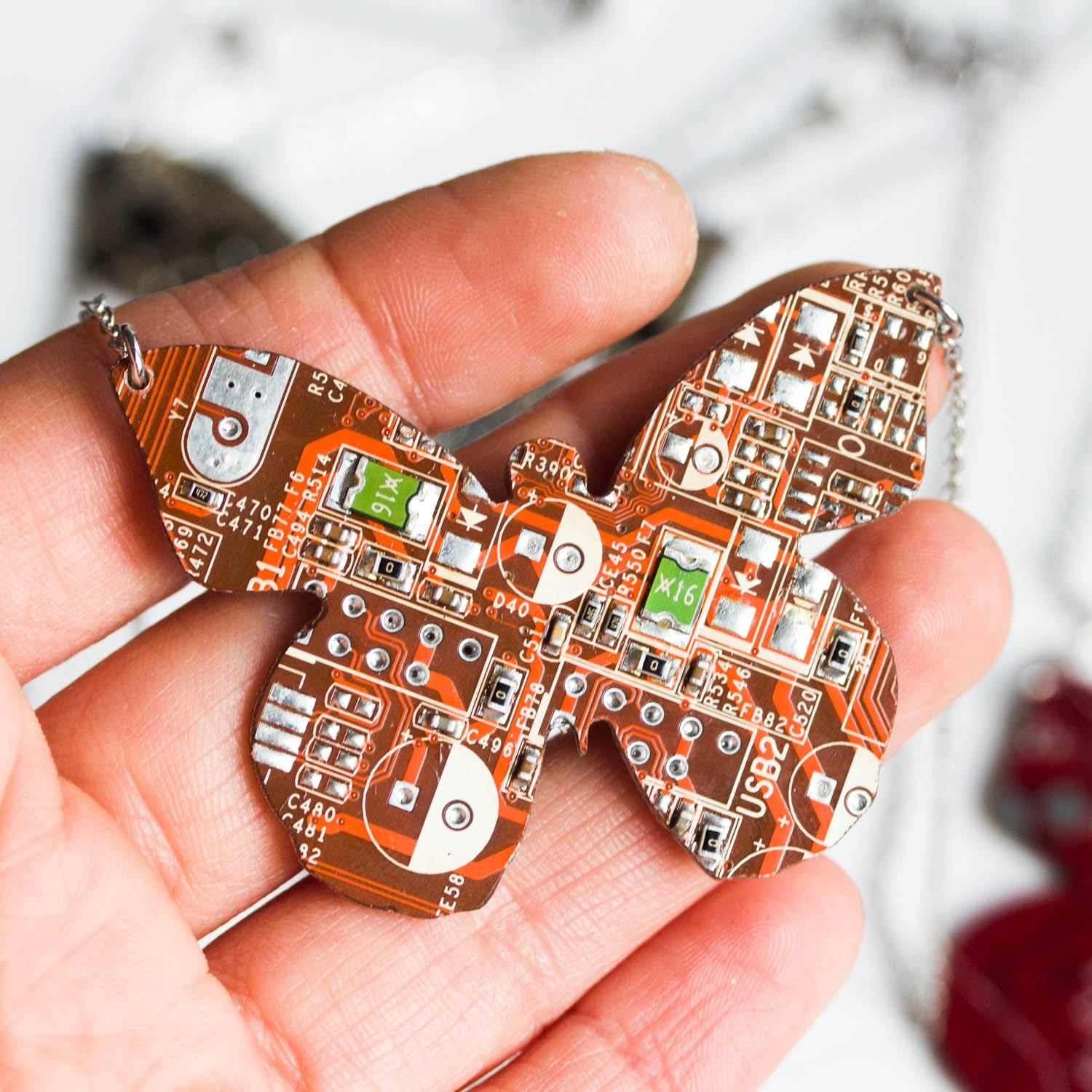 Geeky butterfly necklace made of circuit board