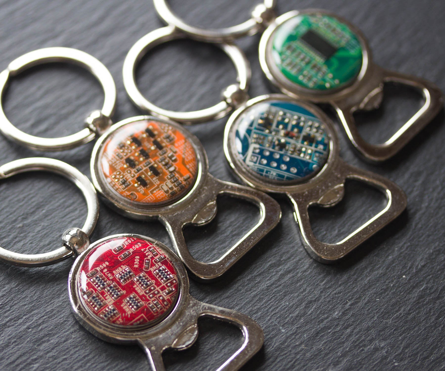 Bottle opener keychain with a circuit board