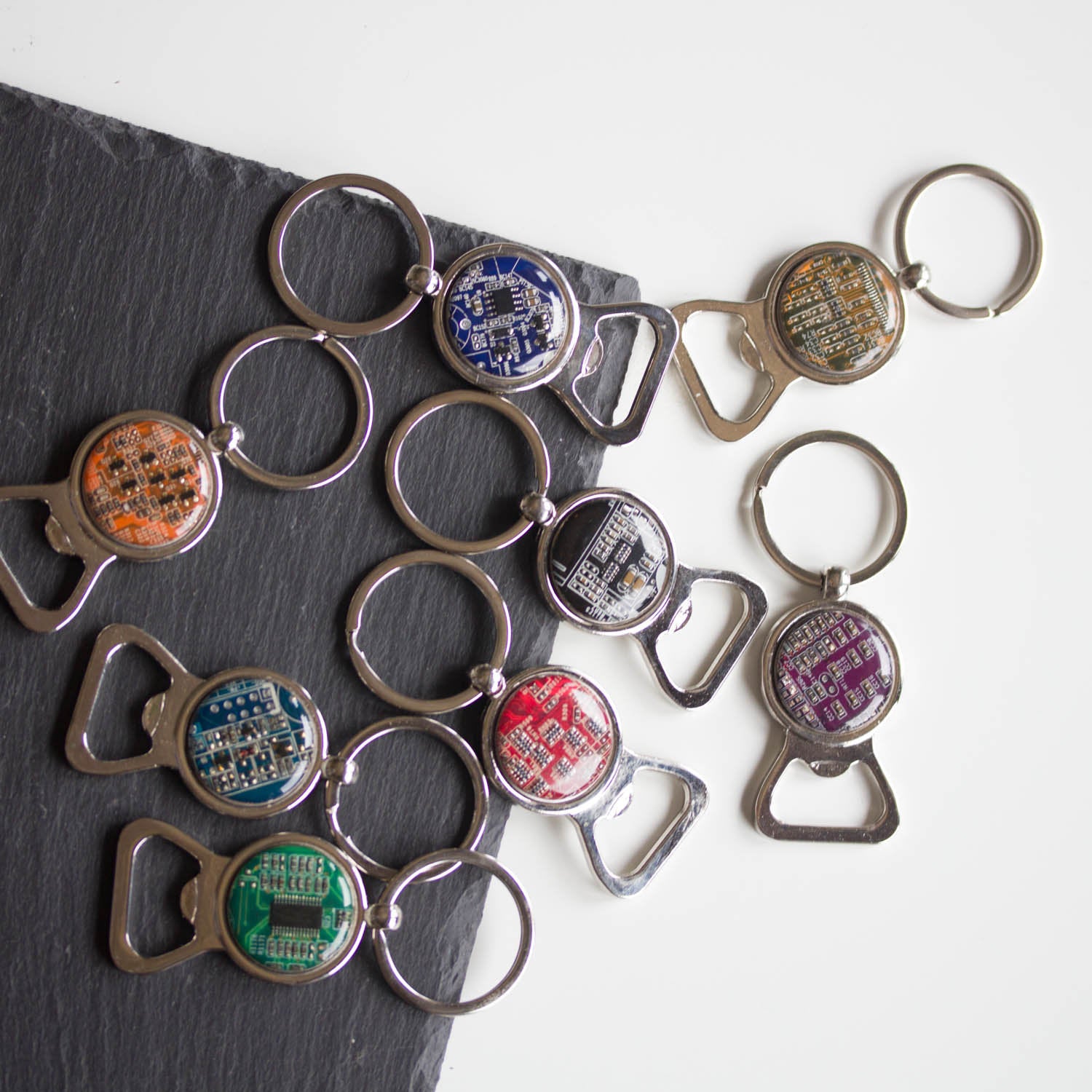Bottle opener keychain with a circuit board