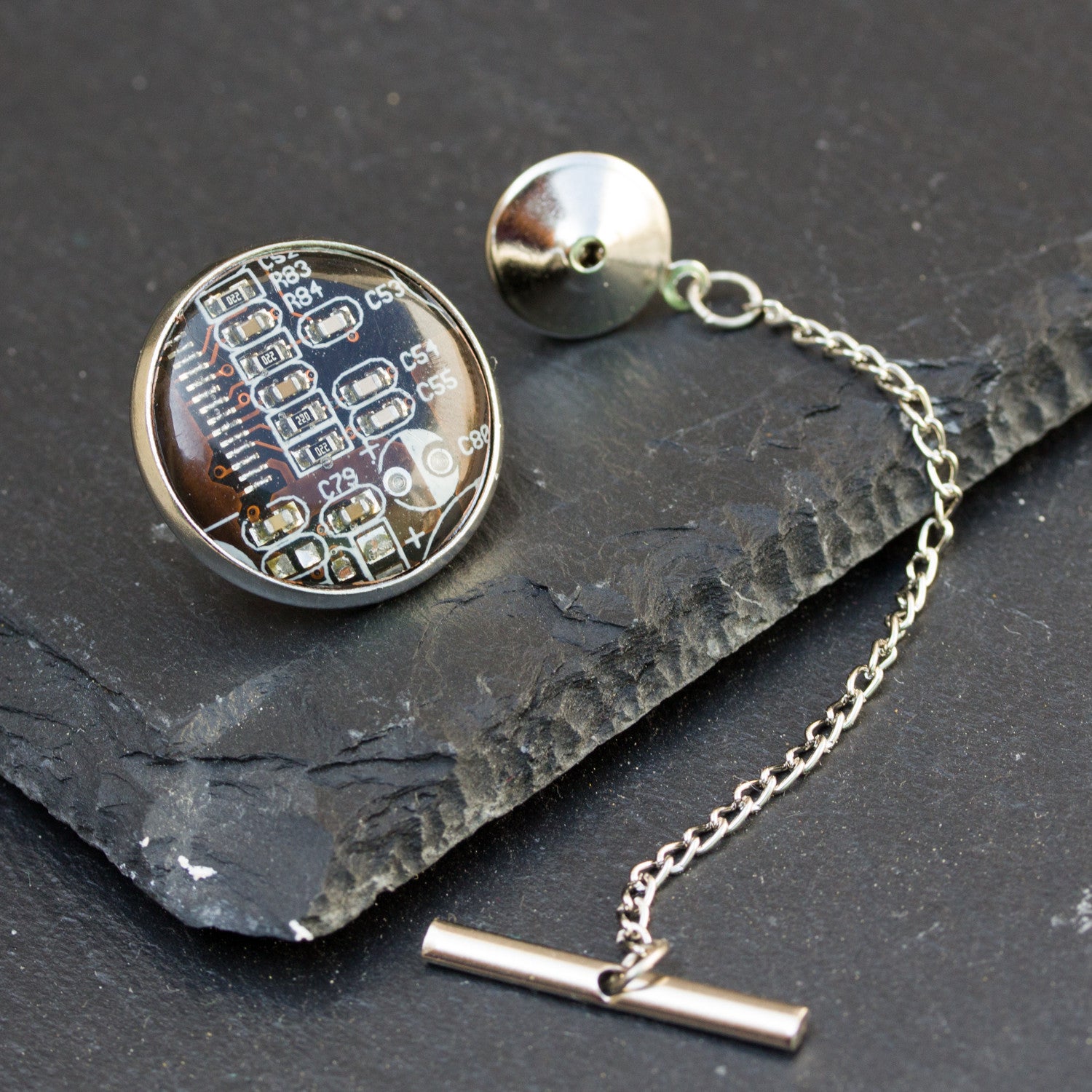 Circuit board tie pin with a chain