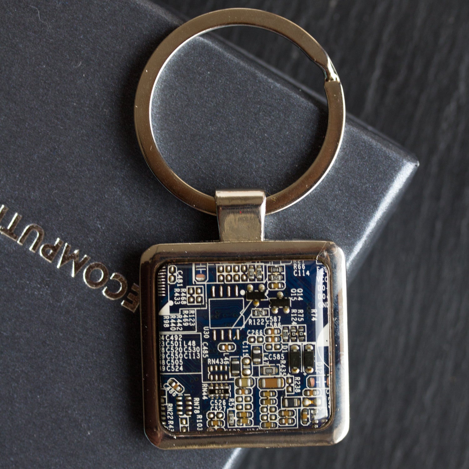 Unique keychain with circuit board piece