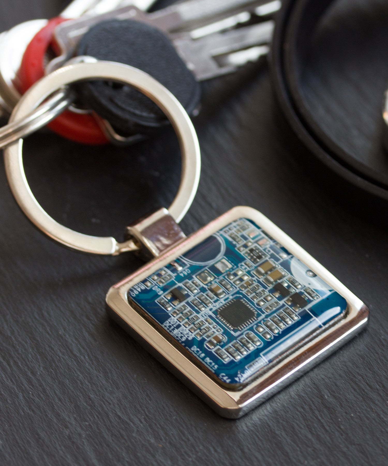 Unique keychain with circuit board piece