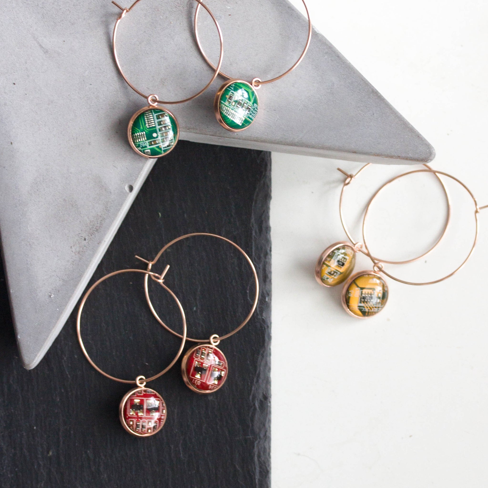Hoop earrings with 12mm round circuit board pendants, rose gold colored wires