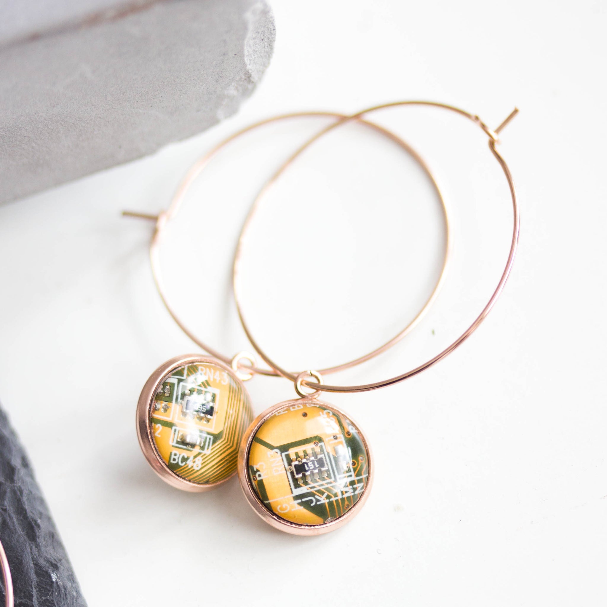 Hoop earrings with 12mm round circuit board pendants, rose gold colored wires