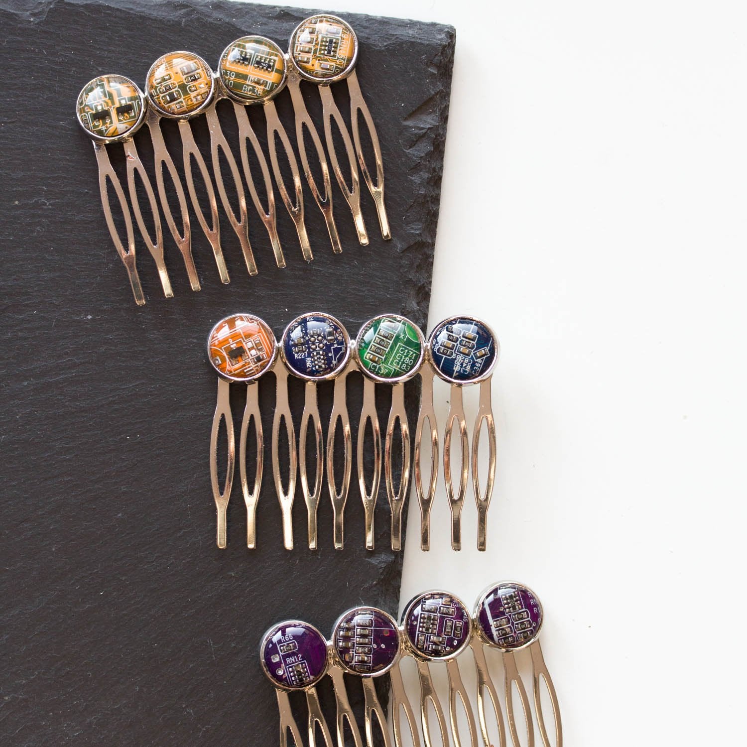 Colorful hair comb with four recycled circuit board pieces
