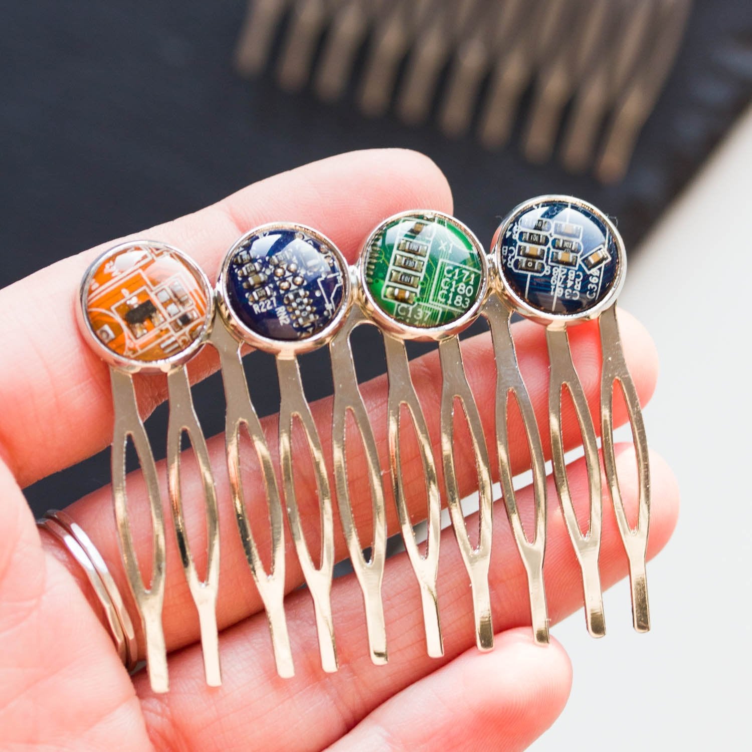 Colorful hair comb with four recycled circuit board pieces