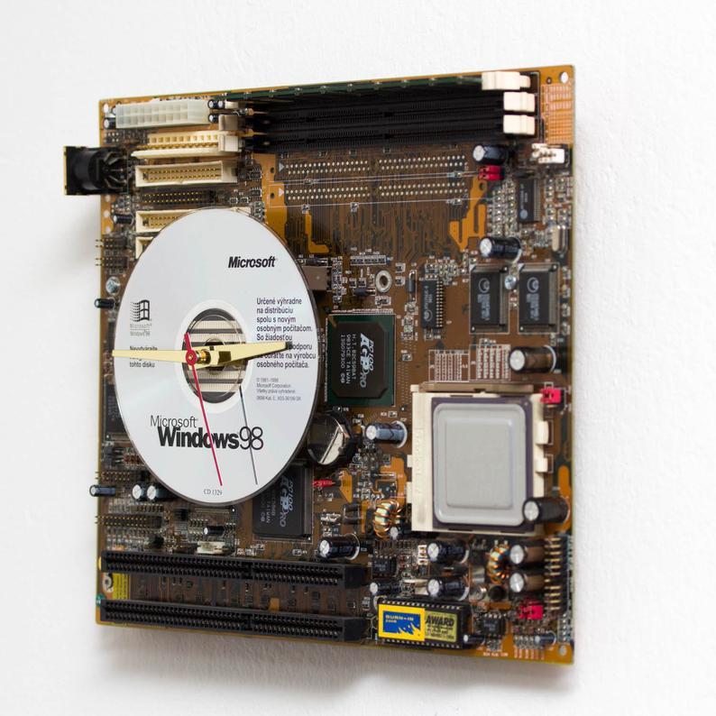 Techie Wall Clock made of yellow / olive green circuit board