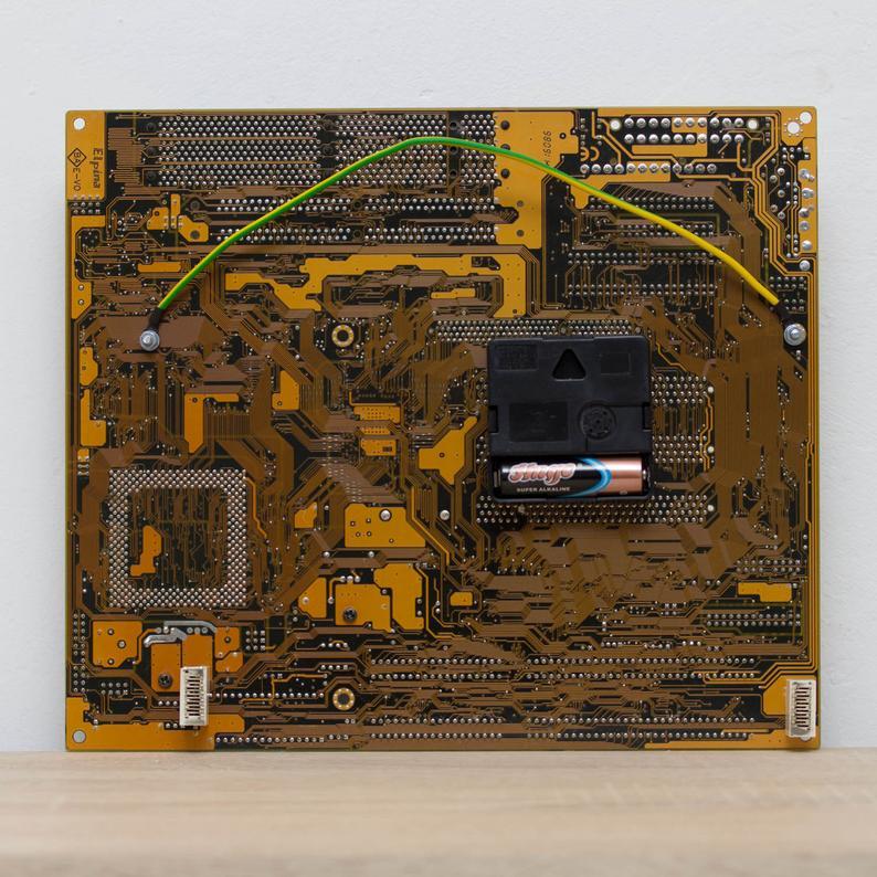 Techie Wall Clock made of yellow / olive green circuit board