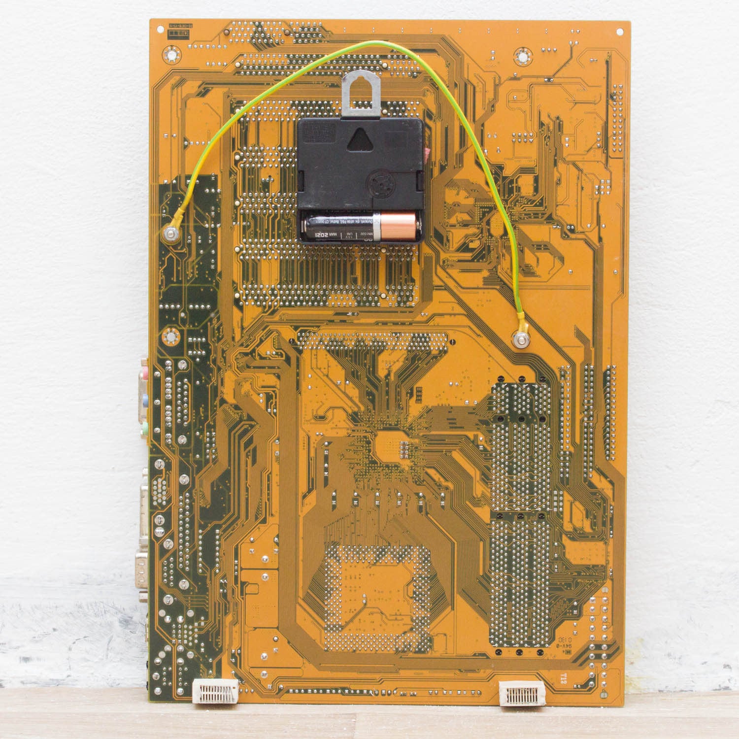 Geeky Wall Clock made of recycled yellow / olive green Circuit Board