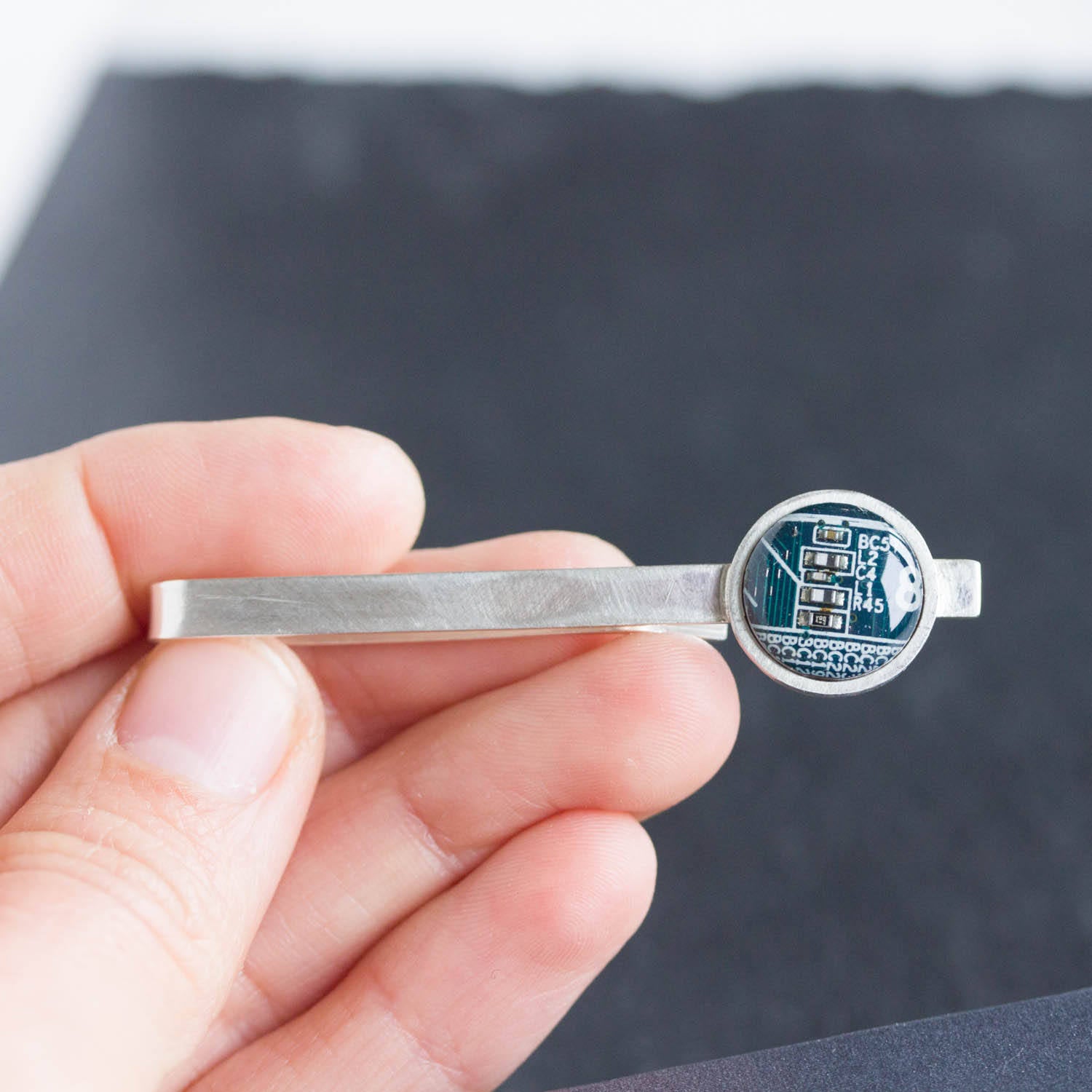 Tie bar with a circuit board piece, sterling silver