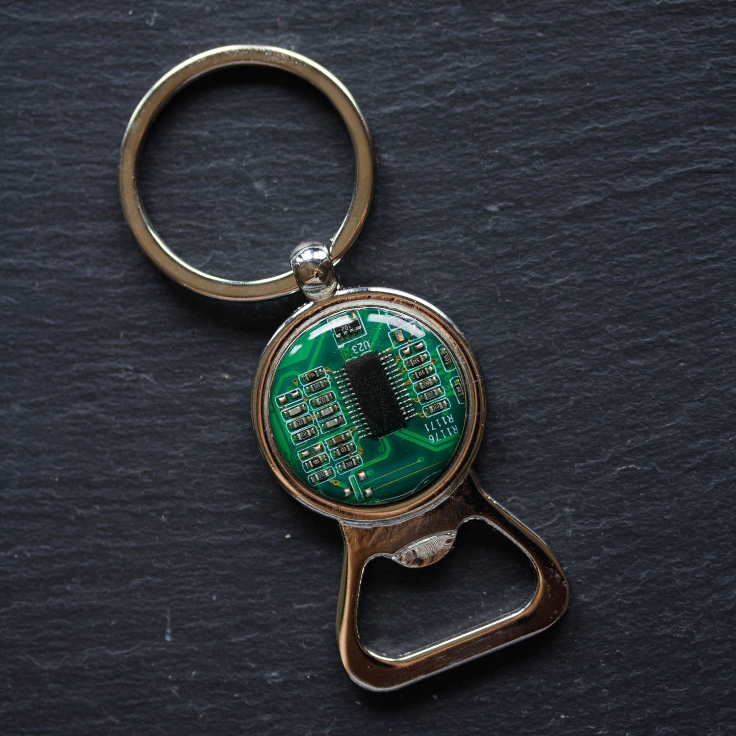 Bottle opener keychain with a circuit board