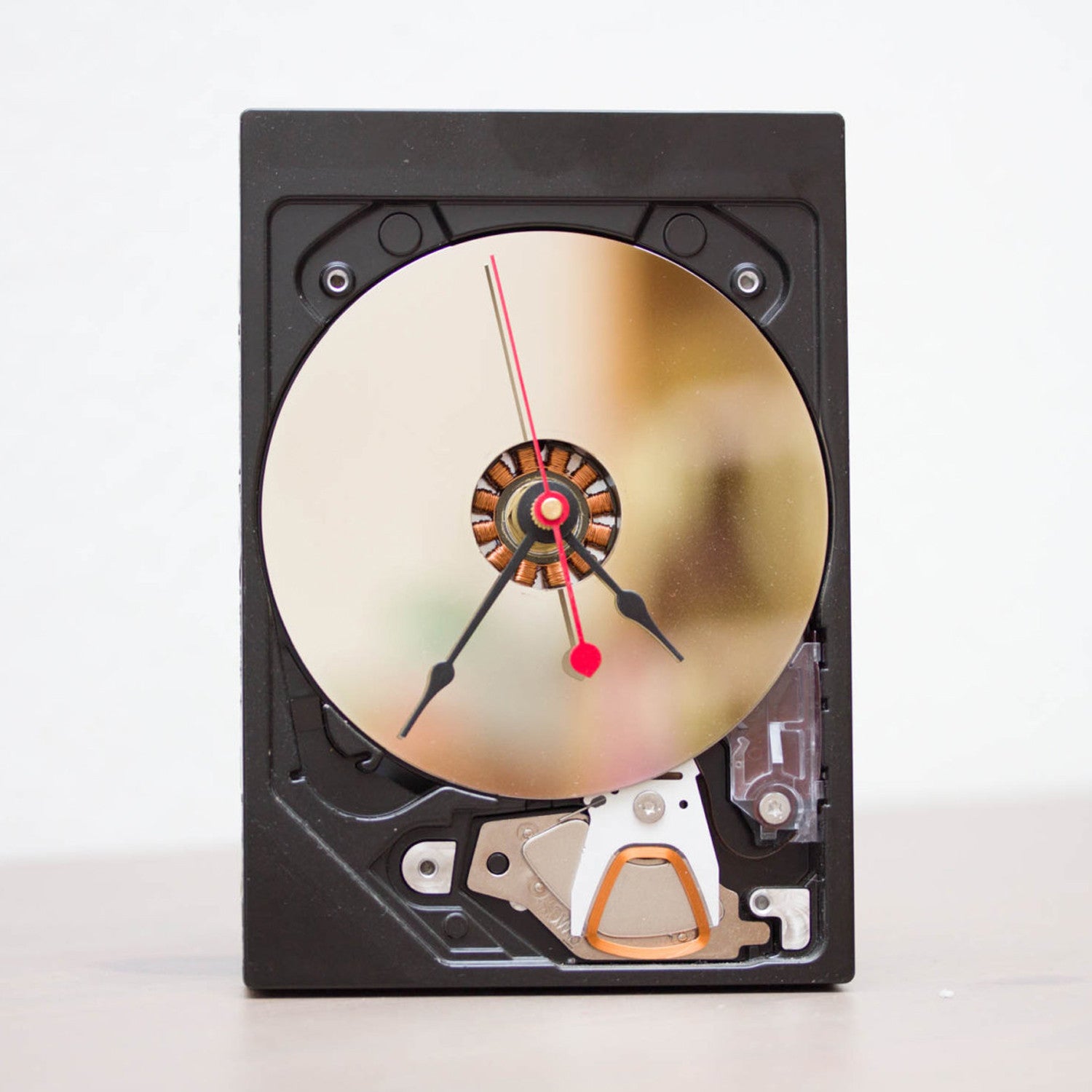 Desk clock made of a recycled HDD